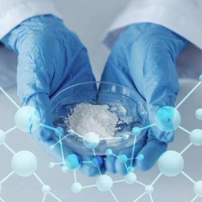 science, chemistry, biology, medicine and people concept - close up of scientist hands holding petri dish with powder in clinical laboratory